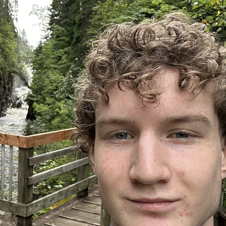 Chris Neville at a forest waterfall